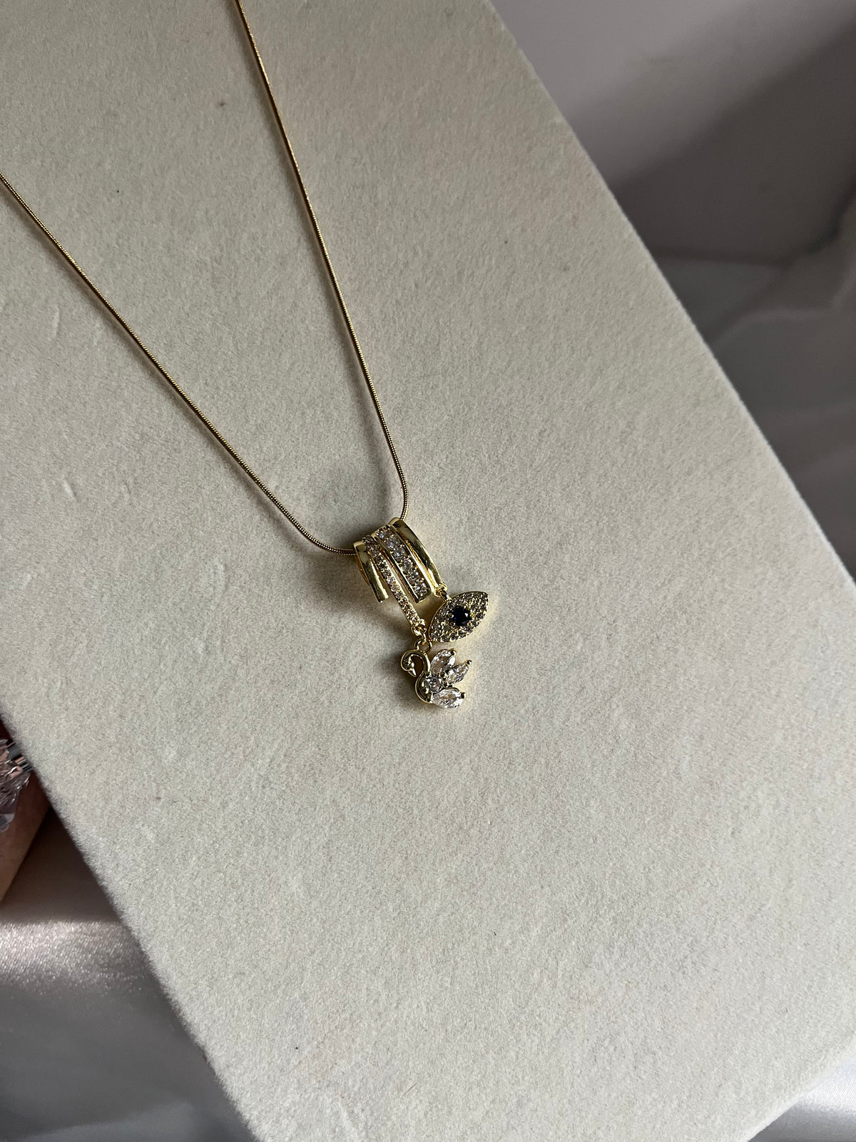 Evil eye & swan charms