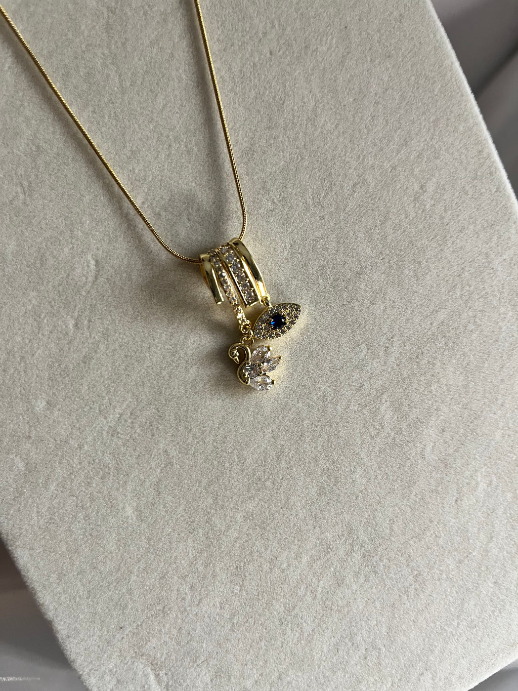 Evil eye & swan charms