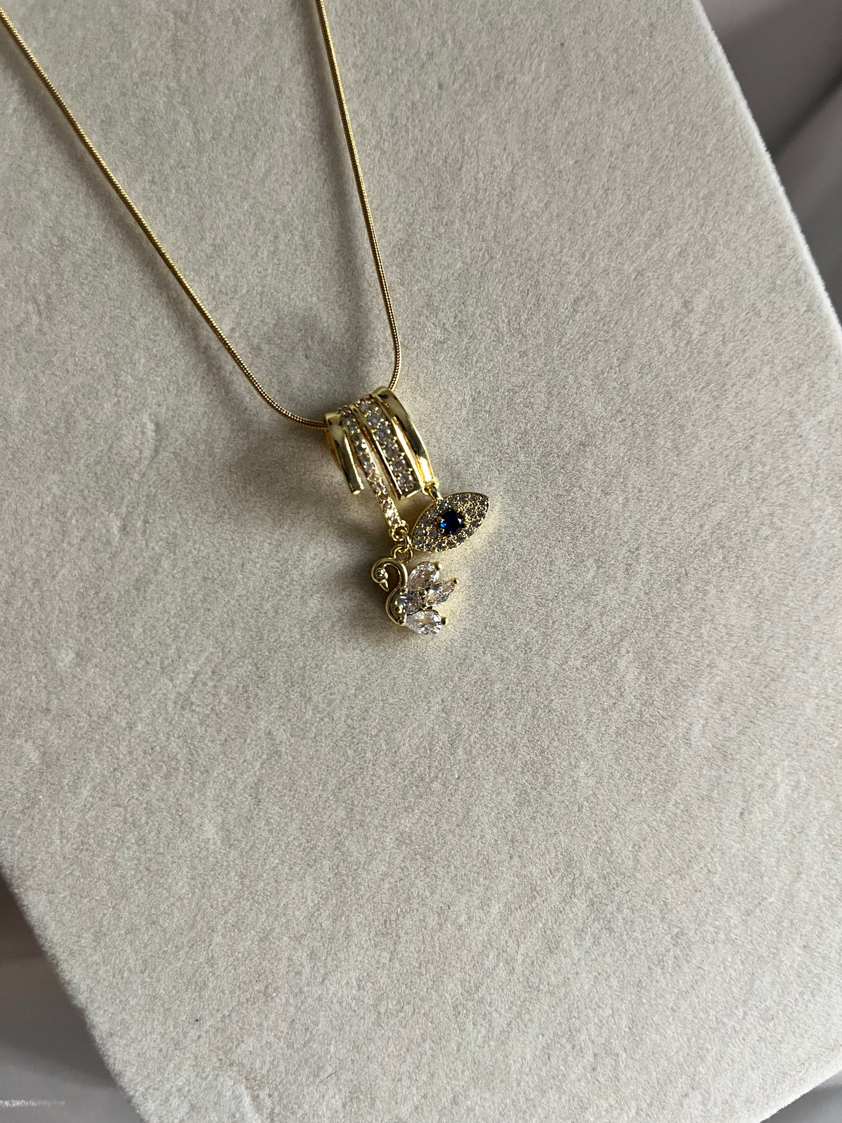 Evil eye & swan charms